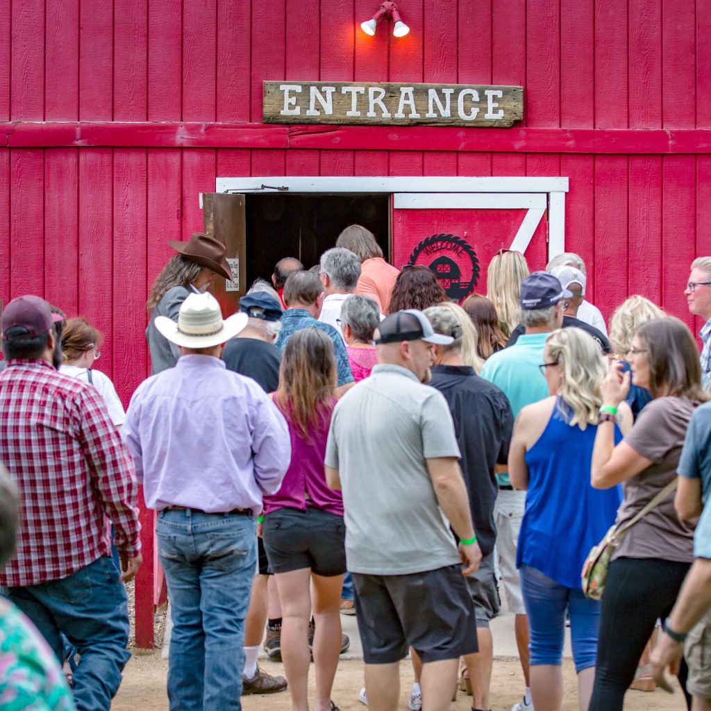Group entering the barn for the dinner and show at Blazin' M Ranch.